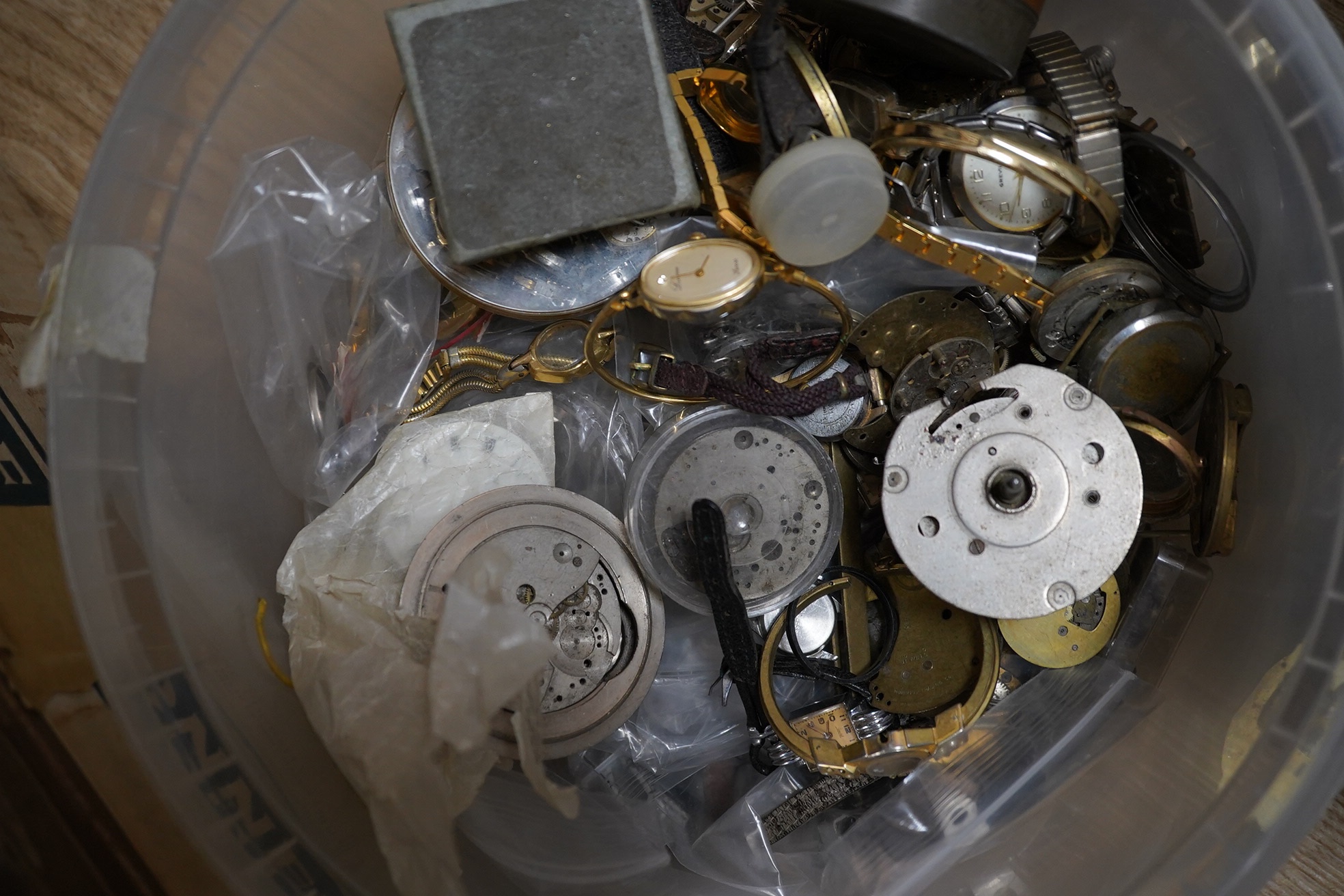 A large quantity of watch parts, spares etc from a watchmaker's studio. Condition - poor to fair